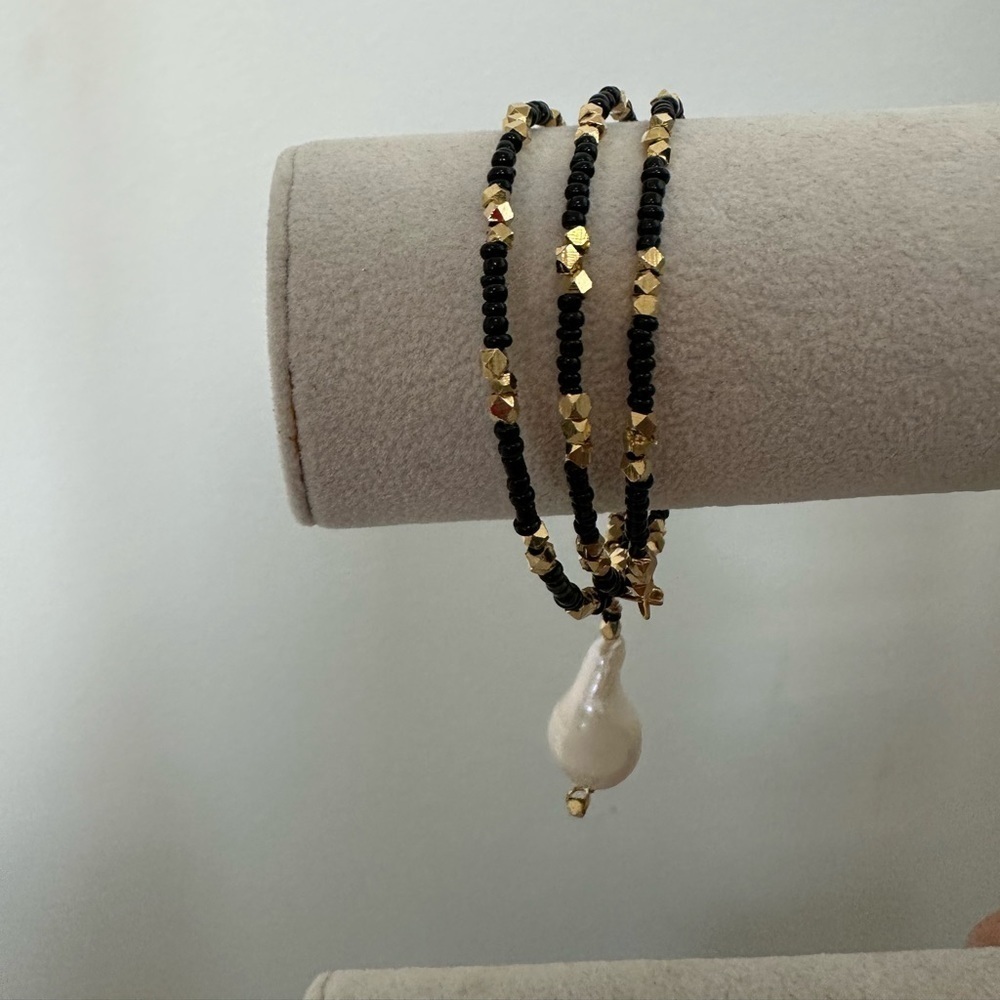 Bangle Bracelet - Wired Bracelet Covered With Black As Well As Gold Tone Beads.